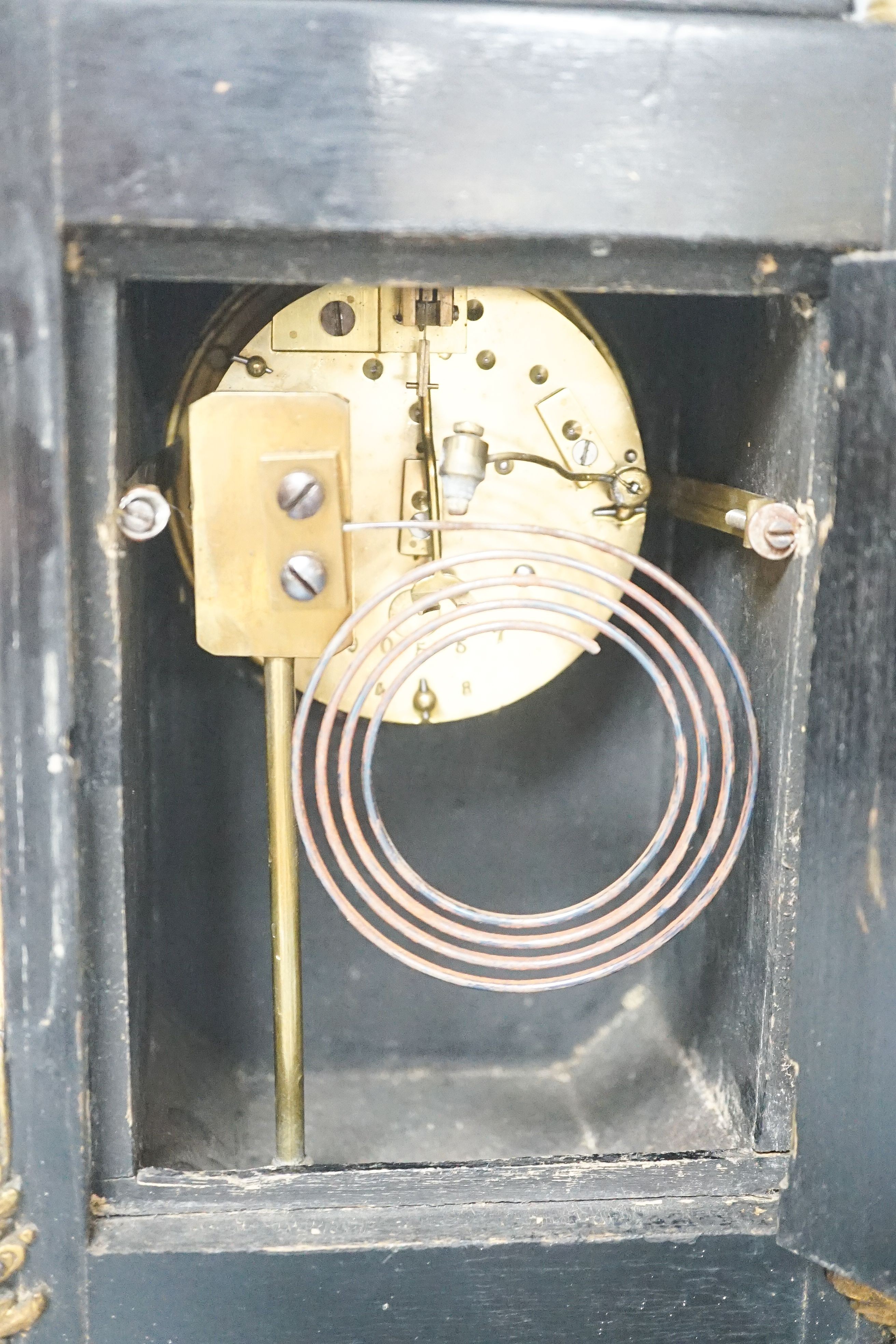 A 19th century French tortoiseshell and gilt metal mounted clock with key and pendulum 40cm